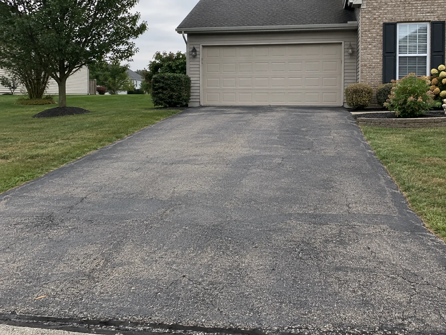 Before: a faded, weathered driveway