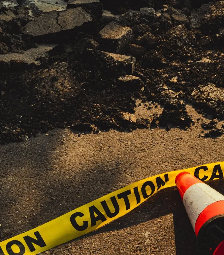 Weathered, cracked asphalt before repair and sealcoating